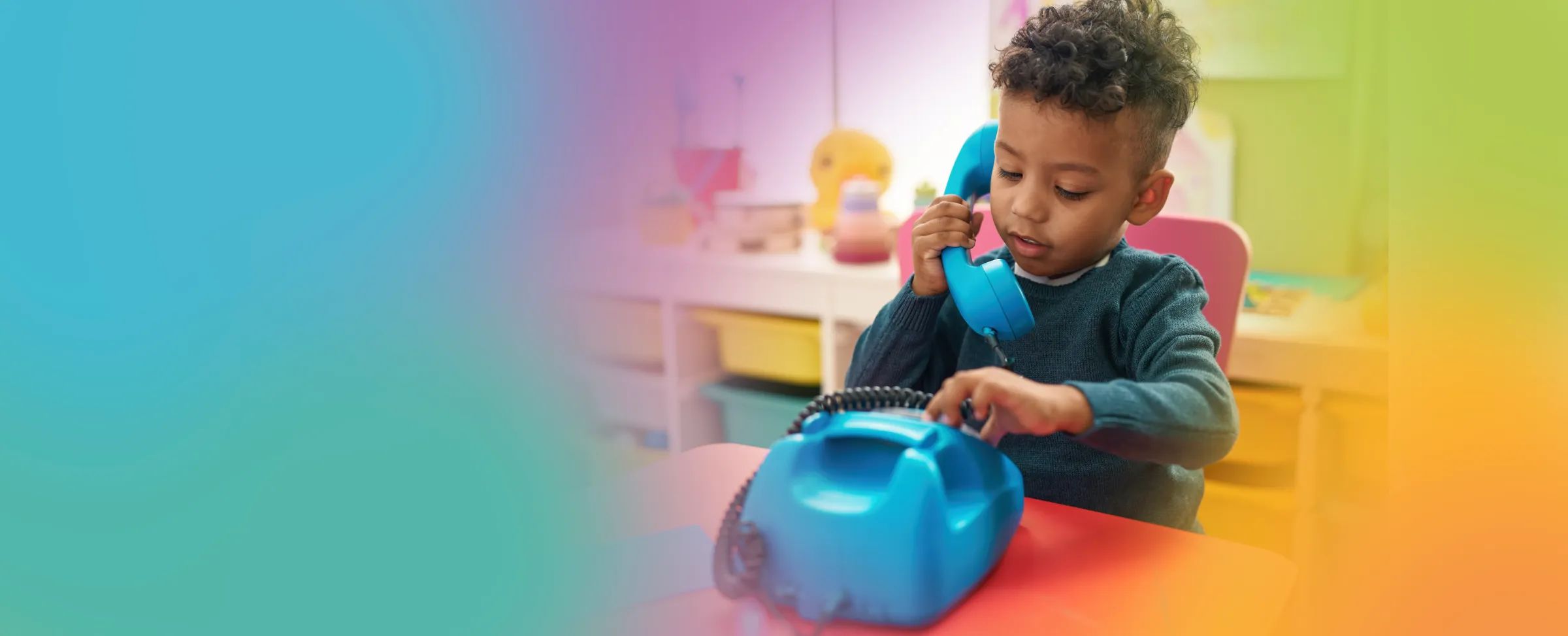 Smiling child building colorful blocks